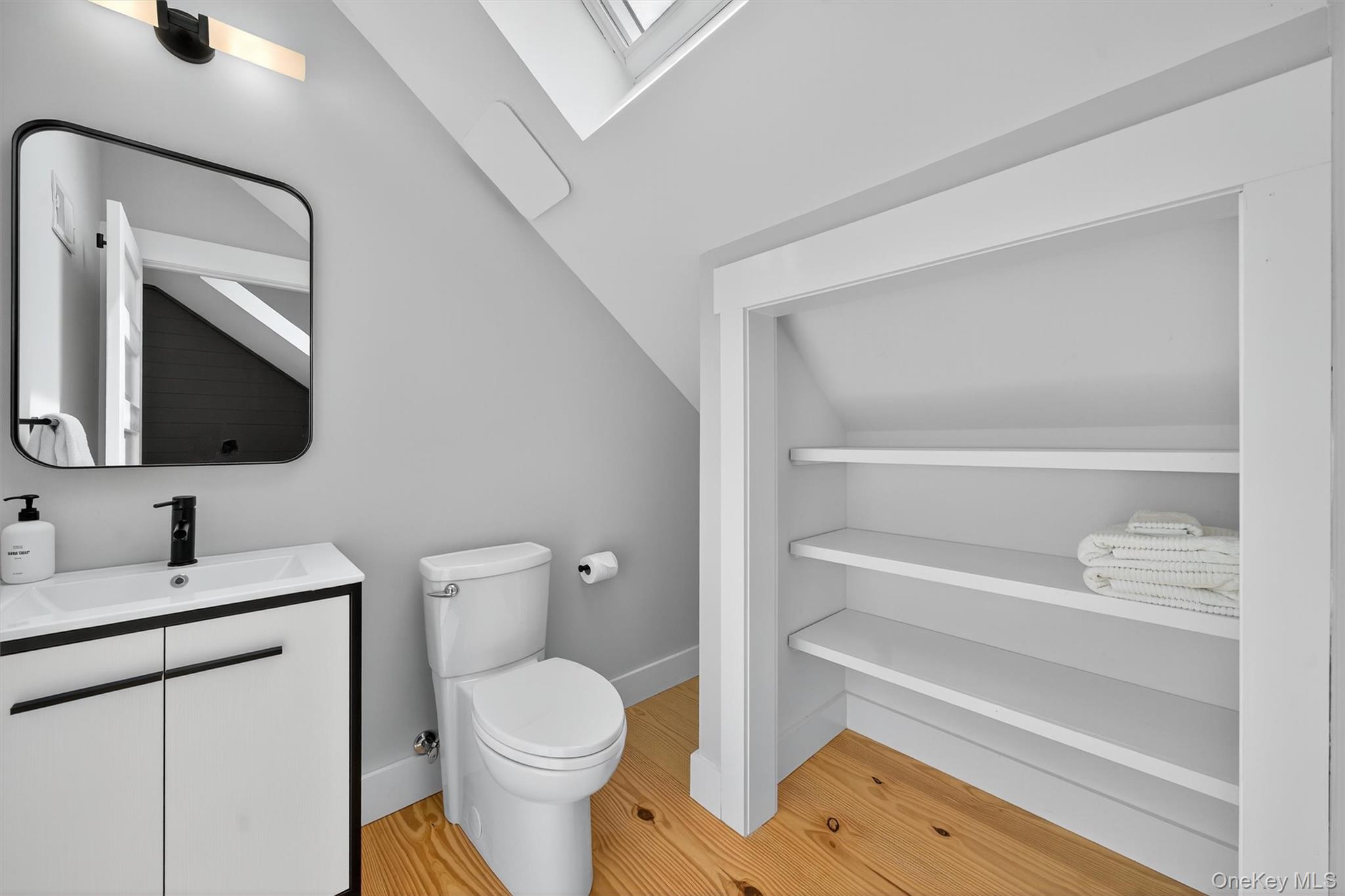 107 Maple Lane Narrowsburg, NY 12764 - Photo 27 of 49 a bathroom with a toilet sink and mirror