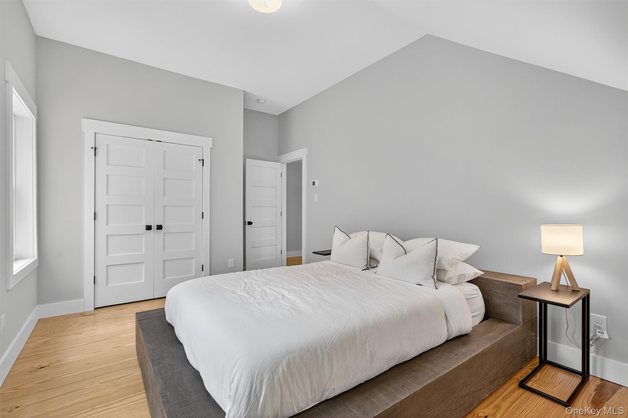 107 Maple Lane Narrowsburg, NY 12764 - Photo 29 of 49 a bedroom with a bed and wooden floor