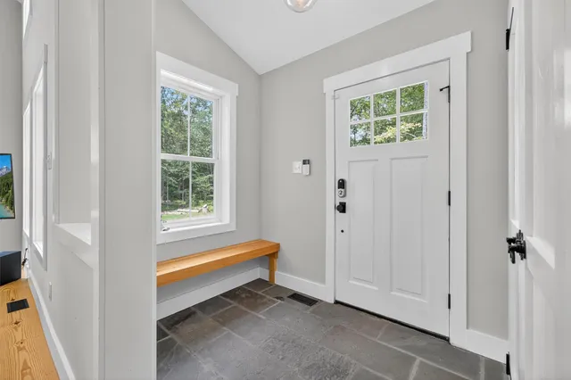 a room that has a window and a bath tub
