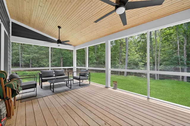 a balcony with furniture and a garden