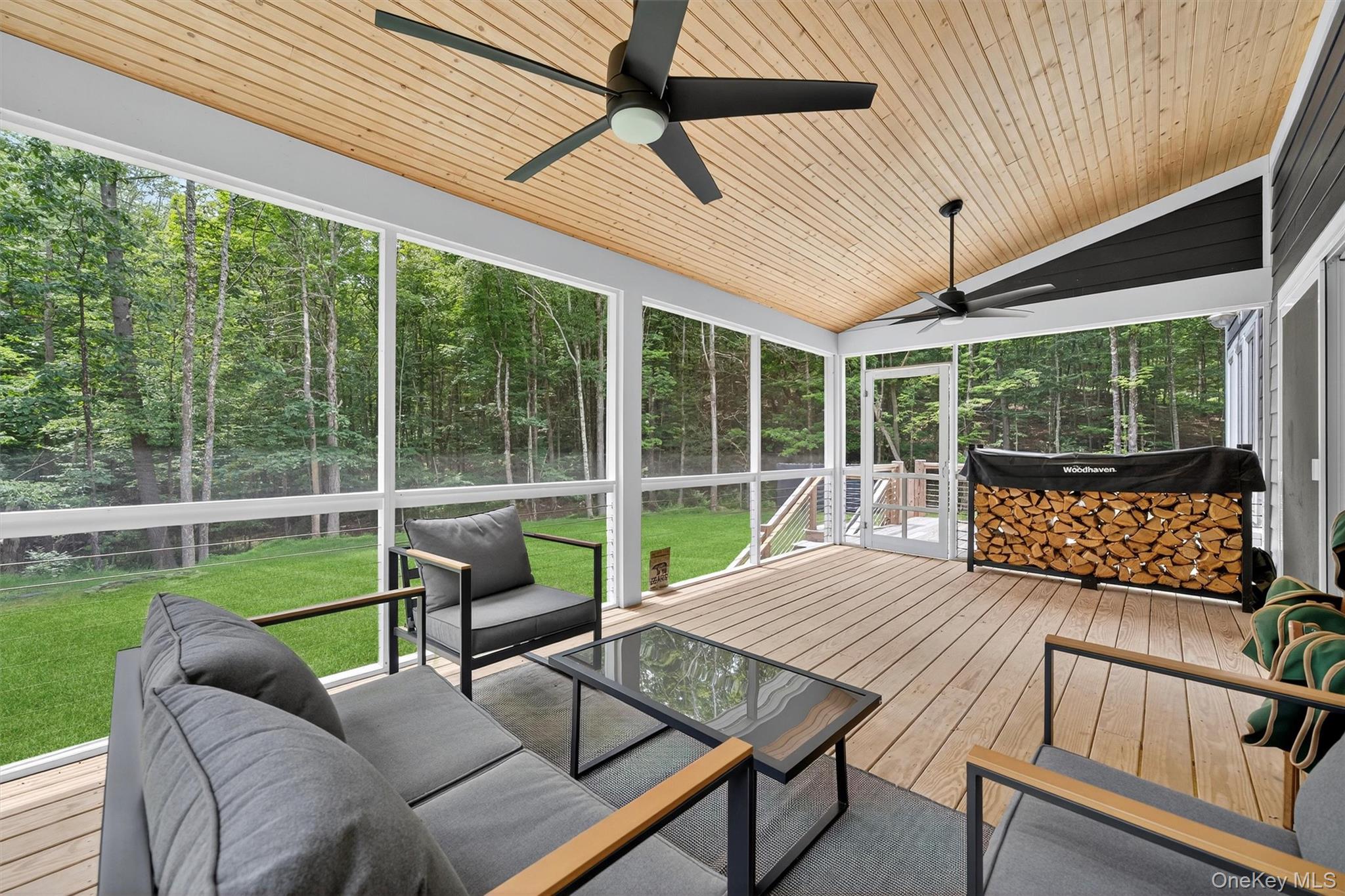 107 Maple Lane Narrowsburg, NY 12764 - Photo 35 of 49 a balcony with furniture and a garden