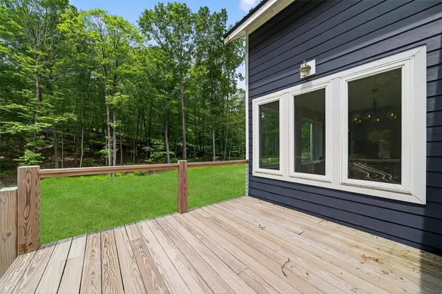 a view of a balcony with a small deck