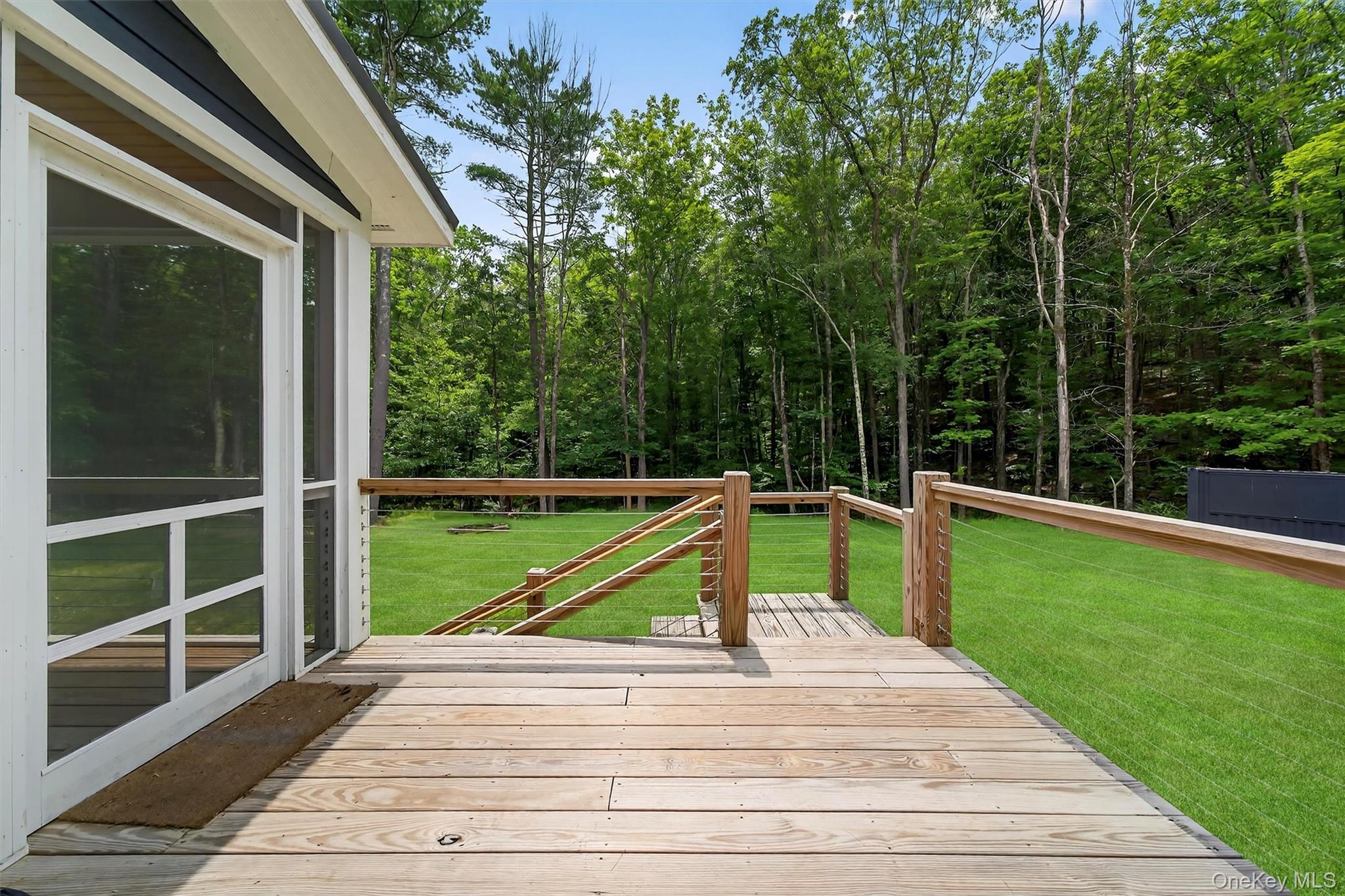 107 Maple Lane Narrowsburg, NY 12764 - Photo 37 of 49 a view of a balcony with a small deck