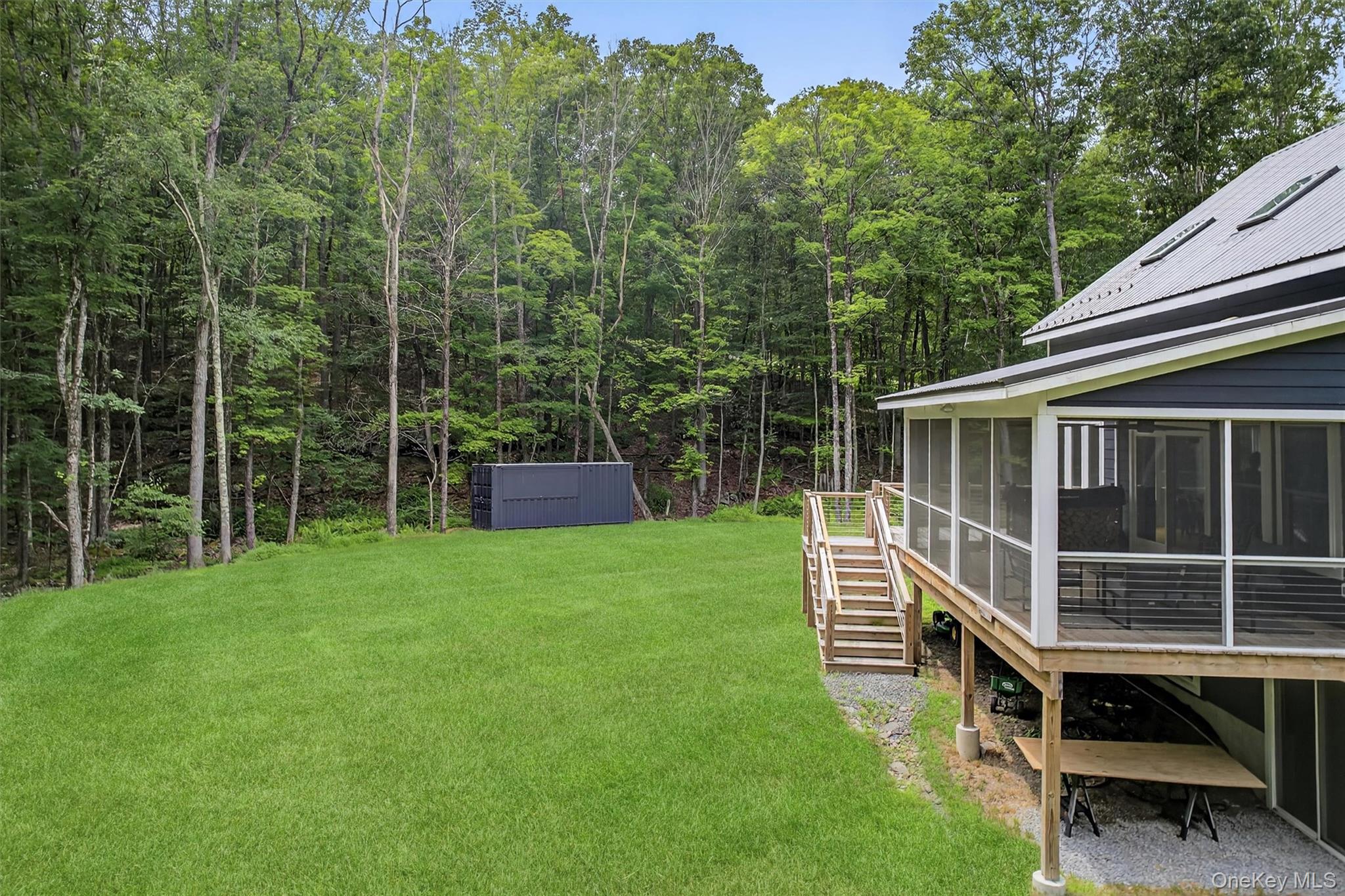 107 Maple Lane Narrowsburg, NY 12764 - Photo 38 of 49 a view of house with backyard porch and entertaining space