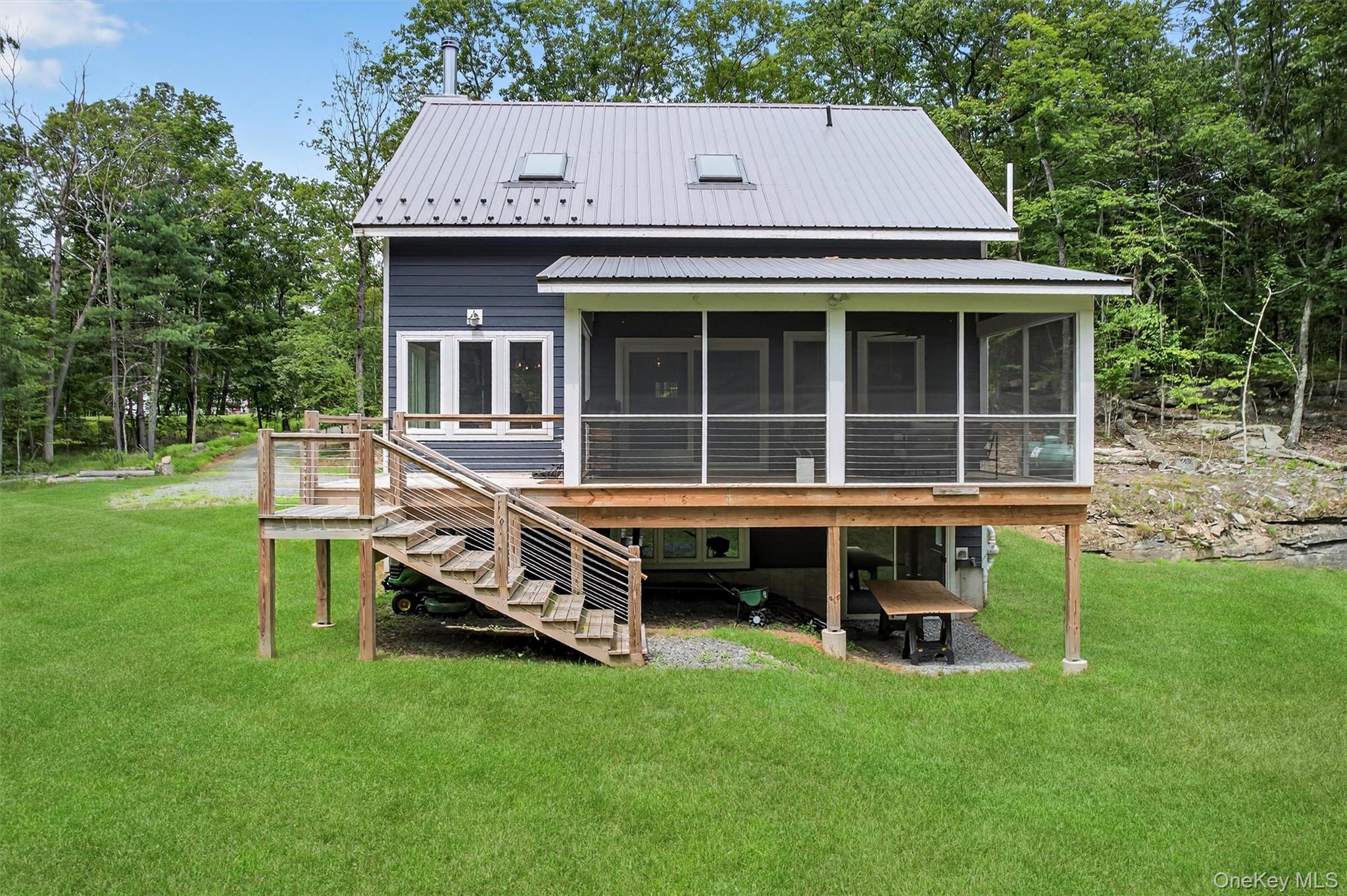 107 Maple Lane Narrowsburg, NY 12764 - Photo 39 of 49 a house view with a garden space