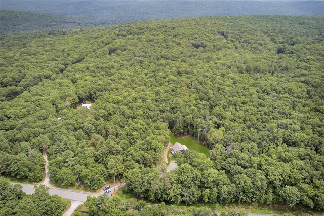 a view of a backyard with sitting area
