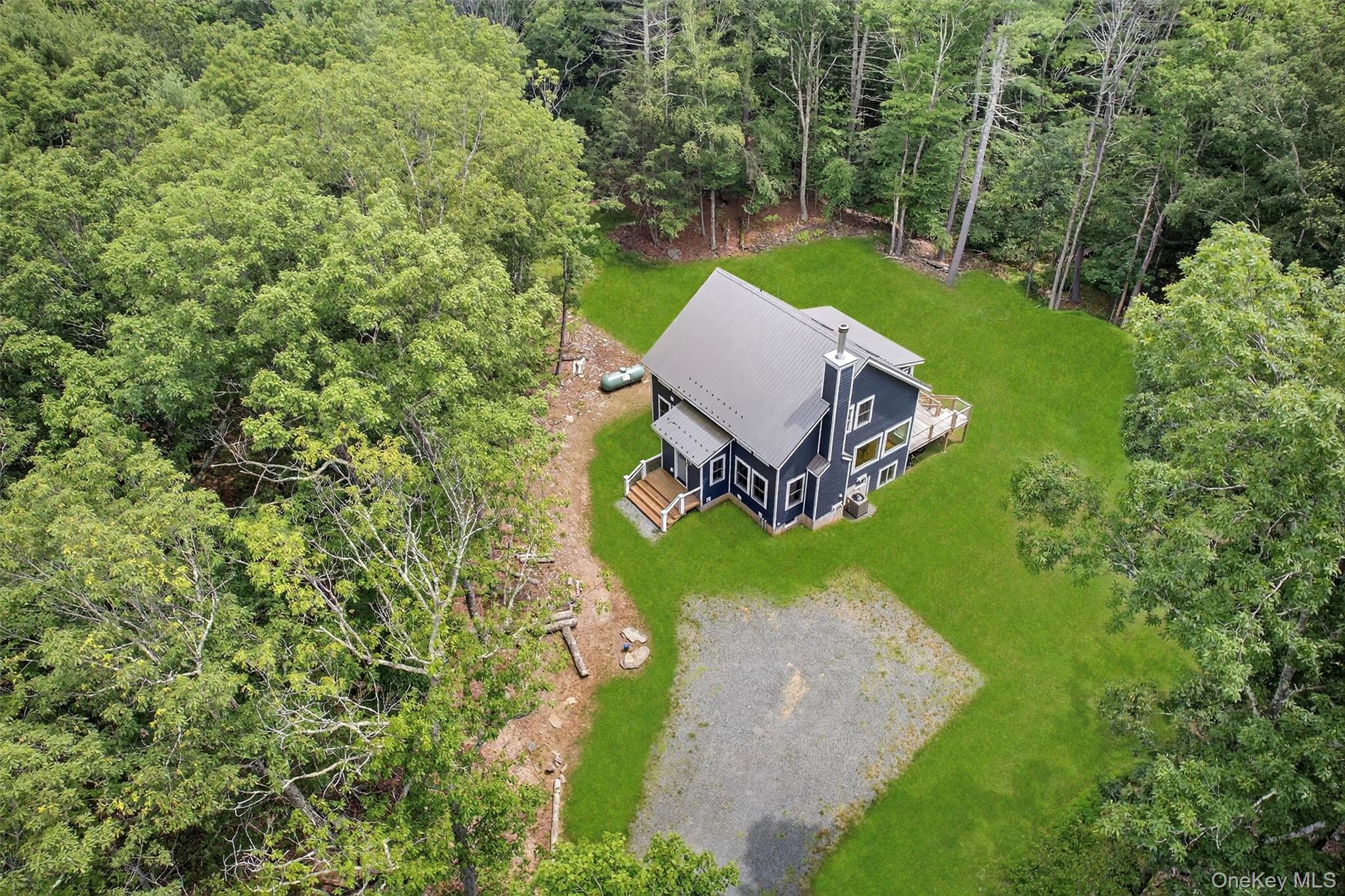 107 Maple Lane Narrowsburg, NY 12764 - Photo 44 of 49 a view of a backyard with sitting area