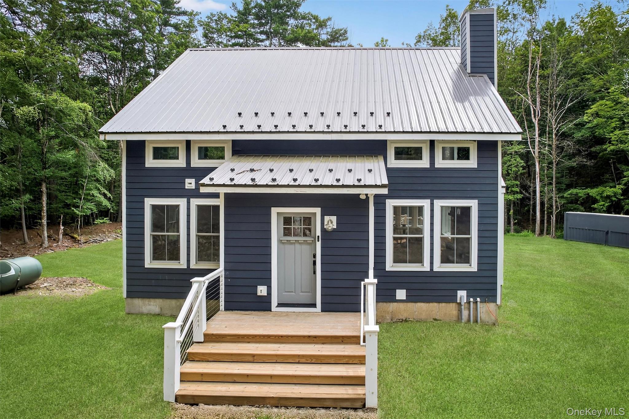 107 Maple Lane Narrowsburg, NY 12764 - Photo 46 of 49 a front view of a house with garden