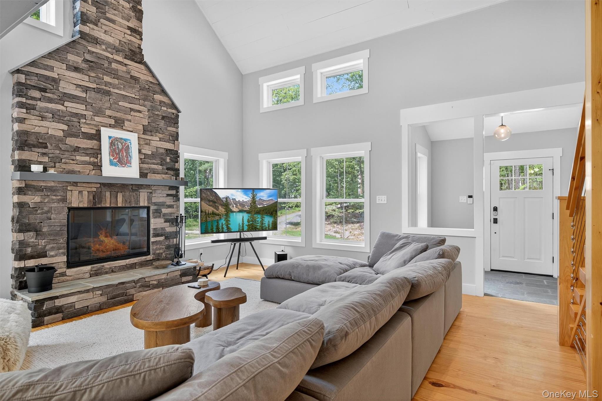 107 Maple Lane Narrowsburg, NY 12764 - Photo 7 of 49 a living room with furniture and a fireplace