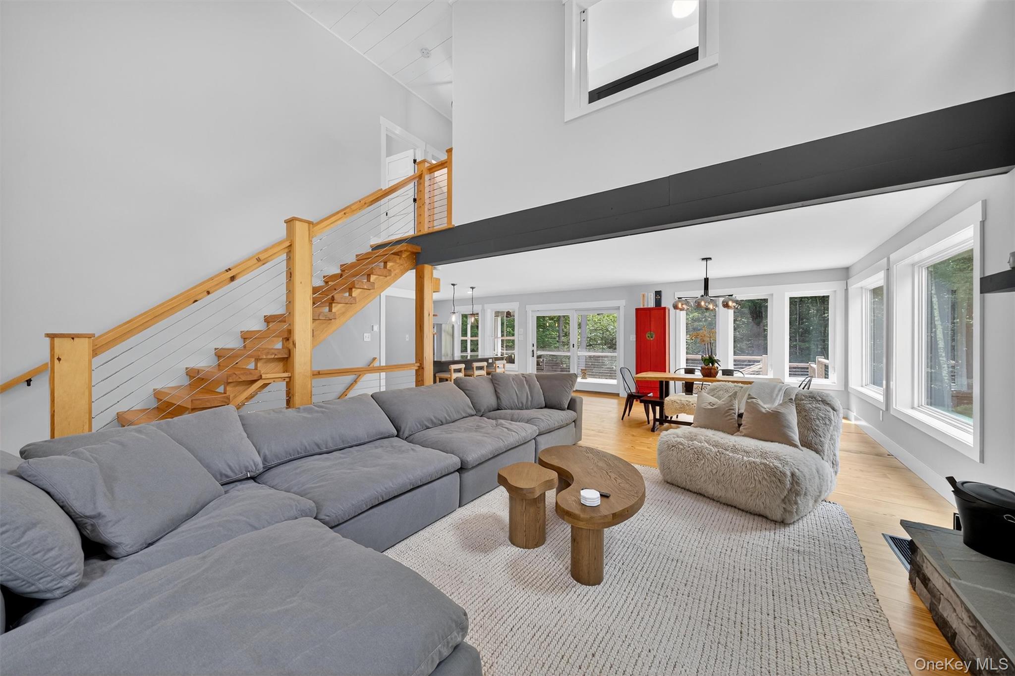 107 Maple Lane Narrowsburg, NY 12764 - Photo 9 of 49 a living room with furniture and a large window
