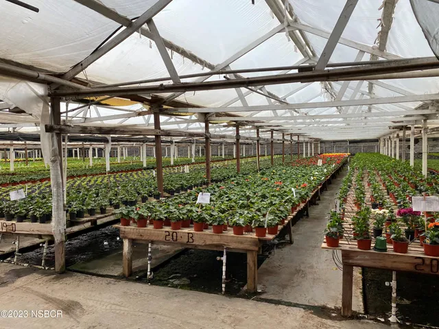 a view of a building with sitting area