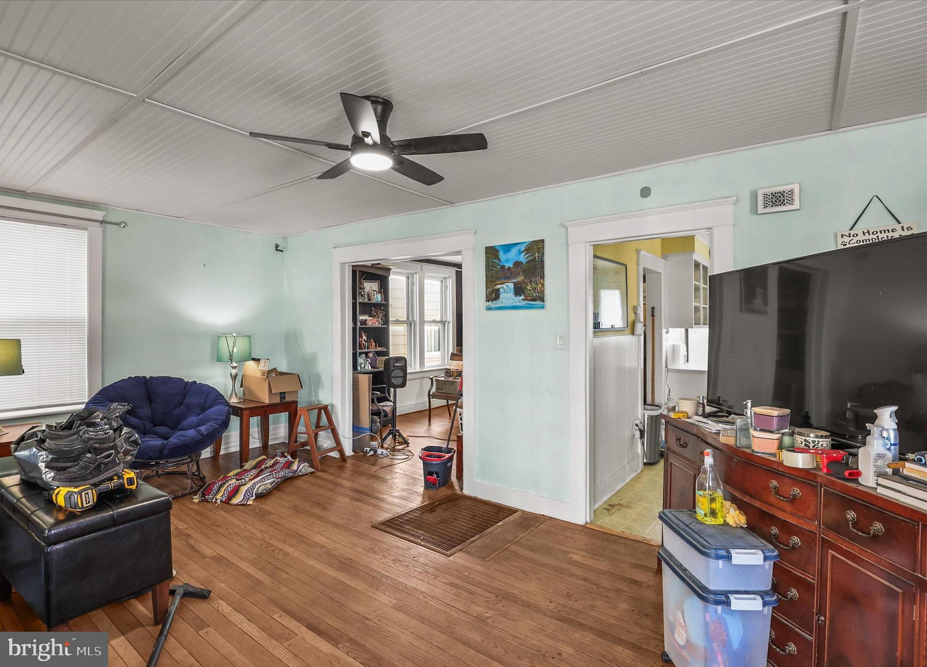 4 Penn Street Hanover, PA 17331 - Photo 5 of 28 Hardwood floor and ceiling fan in living room