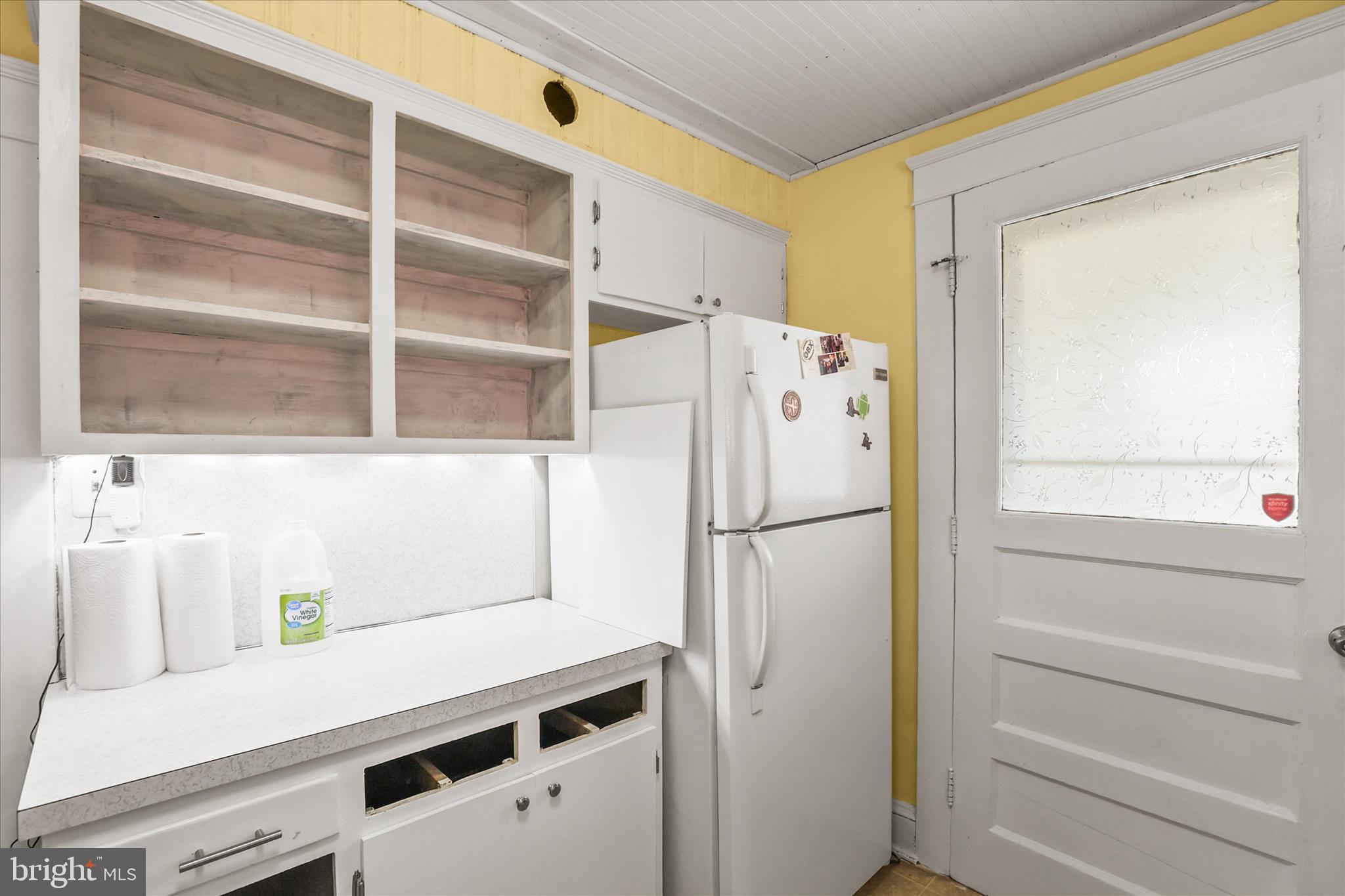 4 Penn Street Hanover, PA 17331 - Photo 9 of 28 Bright kitchen leads to covered patio