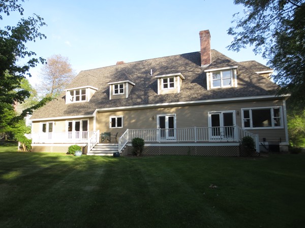 9 Bartkus Farm Concord, MA 01742 - Photo 19 of 19 a front view of a house with a garden