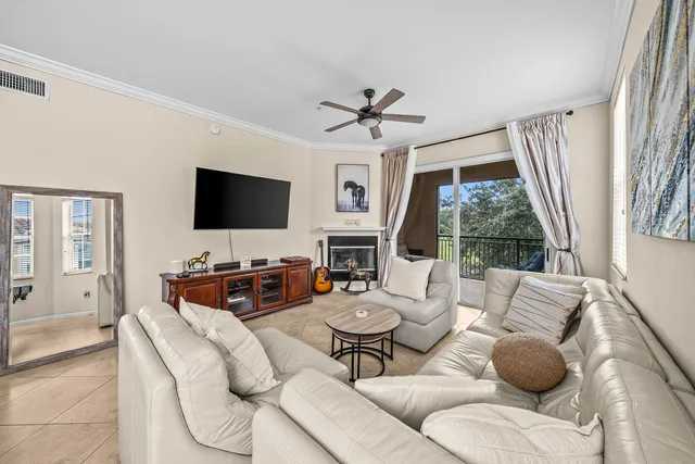 a living room with fireplace furniture and a flat screen tv