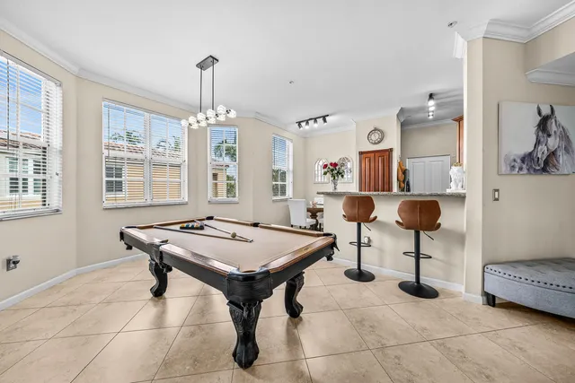 a room with furniture a chandelier and a table