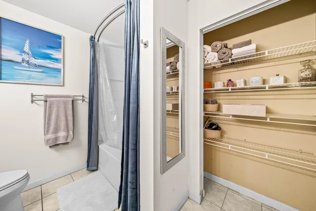 a view of washer and dryer with bathtub