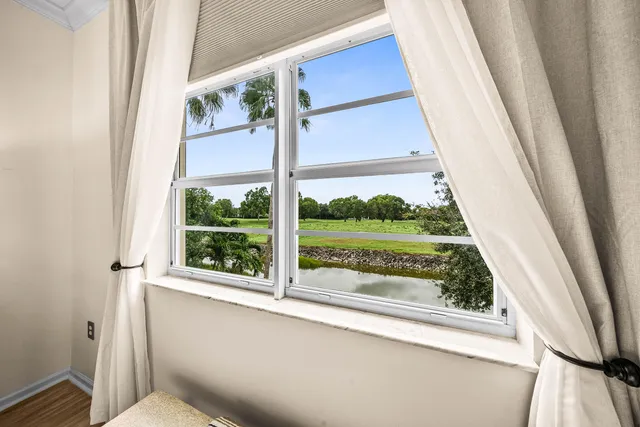 a view of a room with a large window