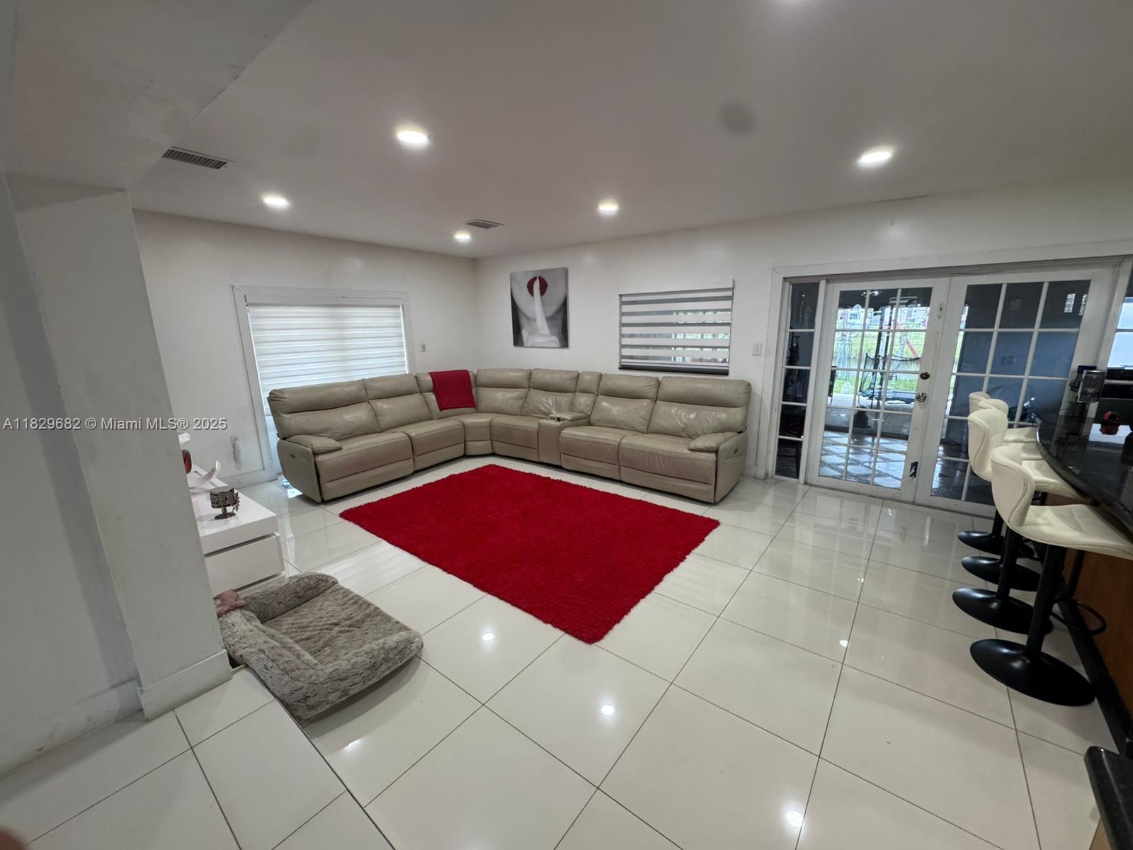 12841 Southwest 54th Street, Unit 1 Miami, FL 33175 - Photo 6 of 15 a living room with furniture