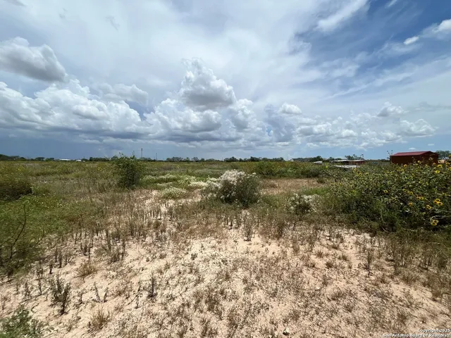 a view of lake with green space