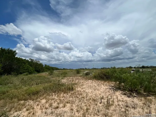 a view of lake with covered with green space
