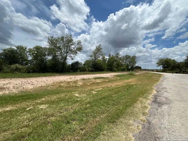 a view of a swimming pool and a yard