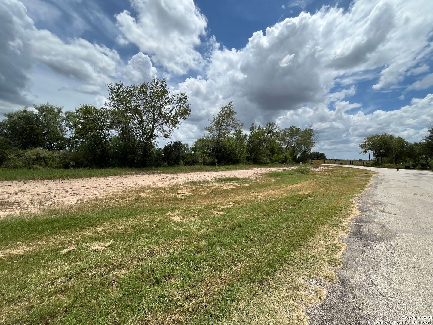 N/a County Road 7714, Unit 4 Devine, TX 78016 - Photo 9 of 10 a view of a swimming pool and a yard