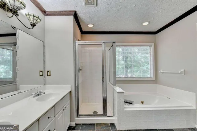 a bathroom with a bathtub and a sink