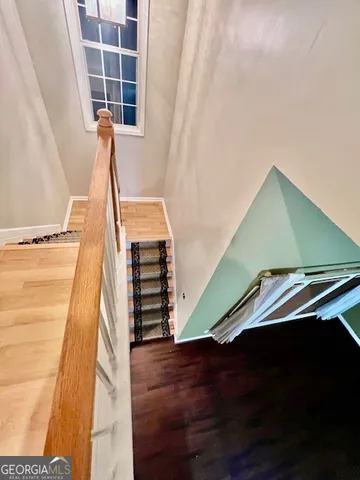 a view of an empty room with stairs