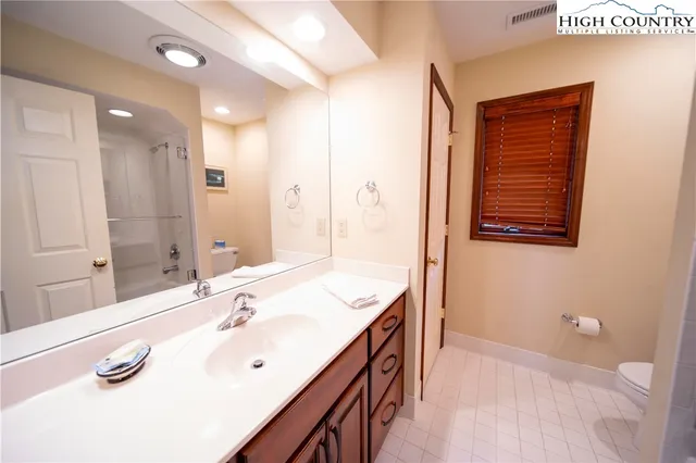 a bathroom with a sink double vanity and a mirror