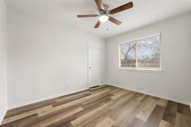 a view of room with window and ceiling fan