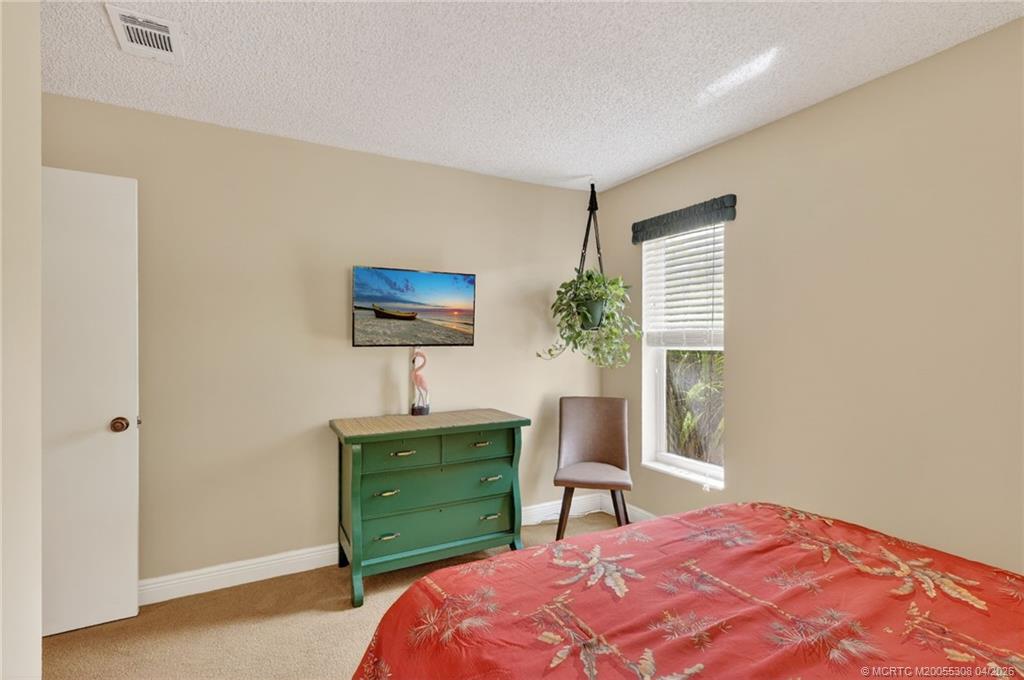 330 Southwest Winnachee Drive Stuart, FL 34994 - Photo 19 of 49 One of three bedrooms.