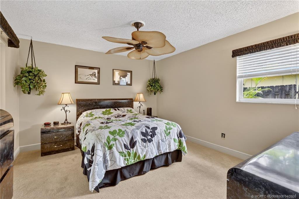 330 Southwest Winnachee Drive Stuart, FL 34994 - Photo 23 of 49 Primary en suite bedroom.