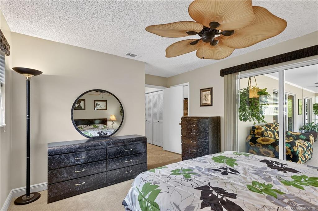 330 Southwest Winnachee Drive Stuart, FL 34994 - Photo 24 of 49 Primary en suite bedroom.