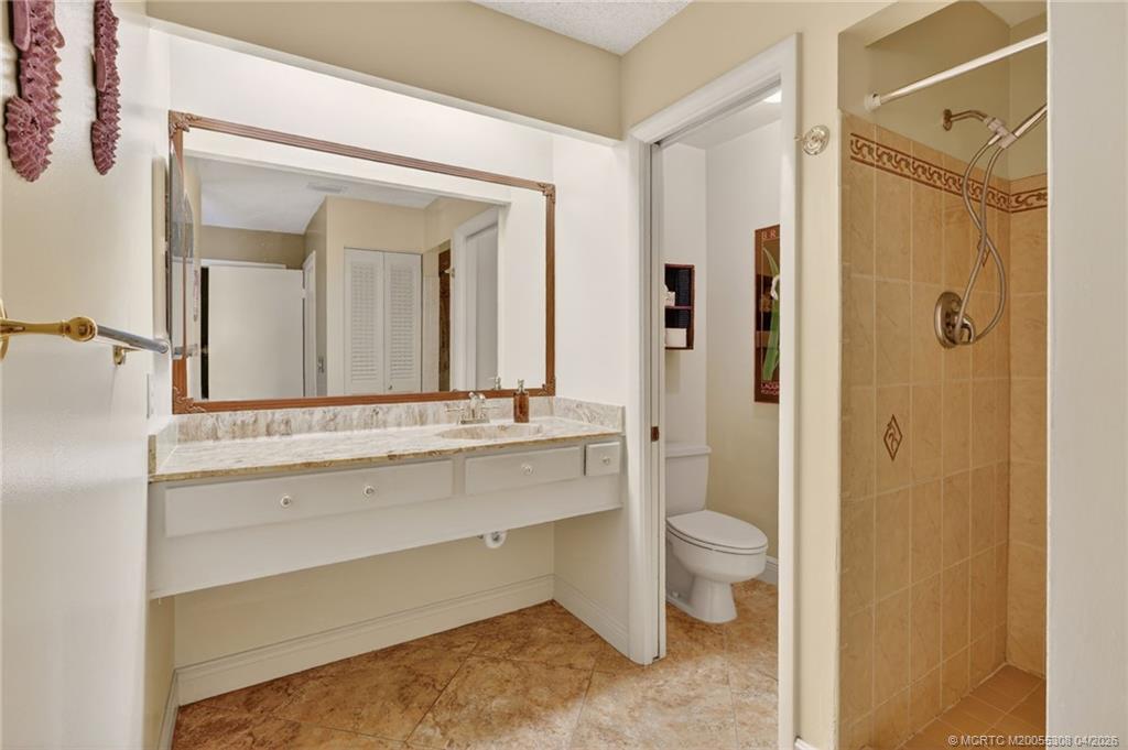 330 Southwest Winnachee Drive Stuart, FL 34994 - Photo 25 of 49 Primary en suite bathroom.