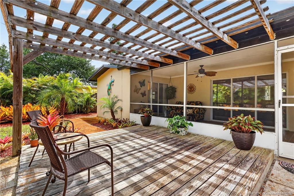 330 Southwest Winnachee Drive Stuart, FL 34994 - Photo 40 of 49 Deck with Pergola. Fully fenced yard.