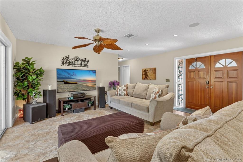 330 Southwest Winnachee Drive Stuart, FL 34994 - Photo 7 of 49 Spacious living area with elevated ceilings.
