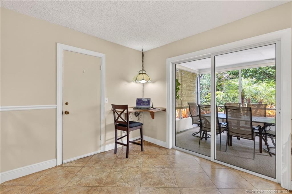 330 Southwest Winnachee Drive Stuart, FL 34994 - Photo 9 of 49 The Kitchen enjoys direct access to the screened patio.