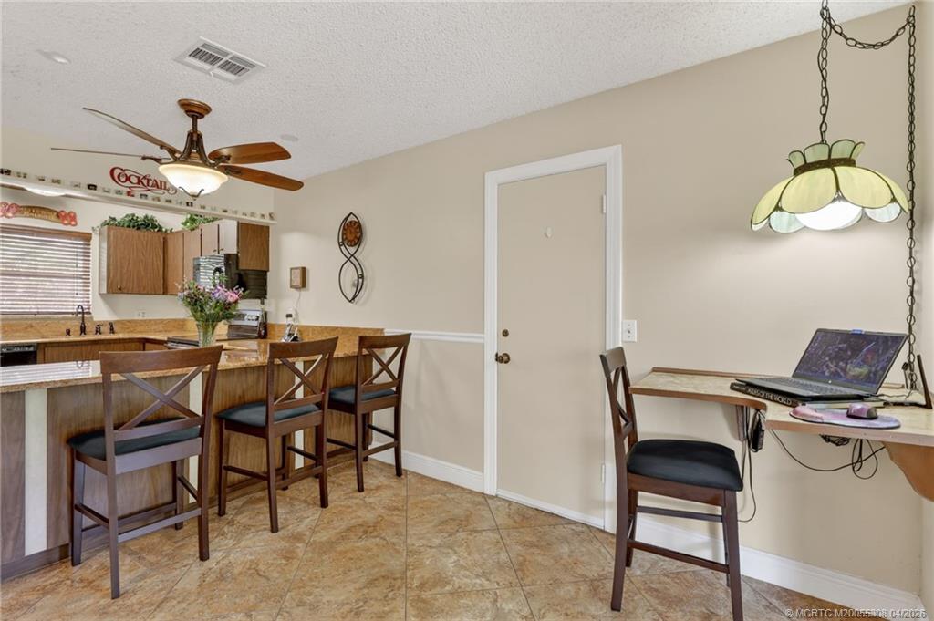 330 Southwest Winnachee Drive Stuart, FL 34994 - Photo 10 of 49 The kitchen flows into the living room for a modern concept.