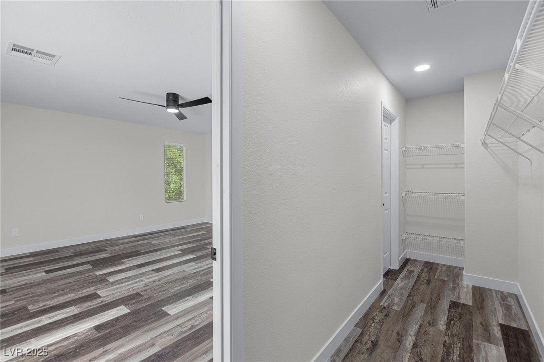 9591 Antelope Bend Court Las Vegas, NV 89148 - Photo 30 of 56 Closet with dark wood finished floors and recessed lighting
