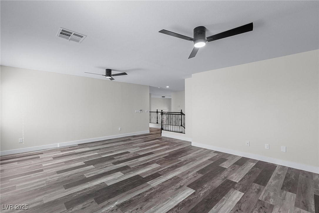 9591 Antelope Bend Court Las Vegas, NV 89148 - Photo 37 of 56 Unfurnished loft featuring dark wood-style floors, ceiling fan, and recessed lighting
