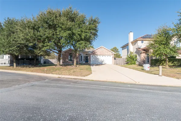 a house with trees in the background