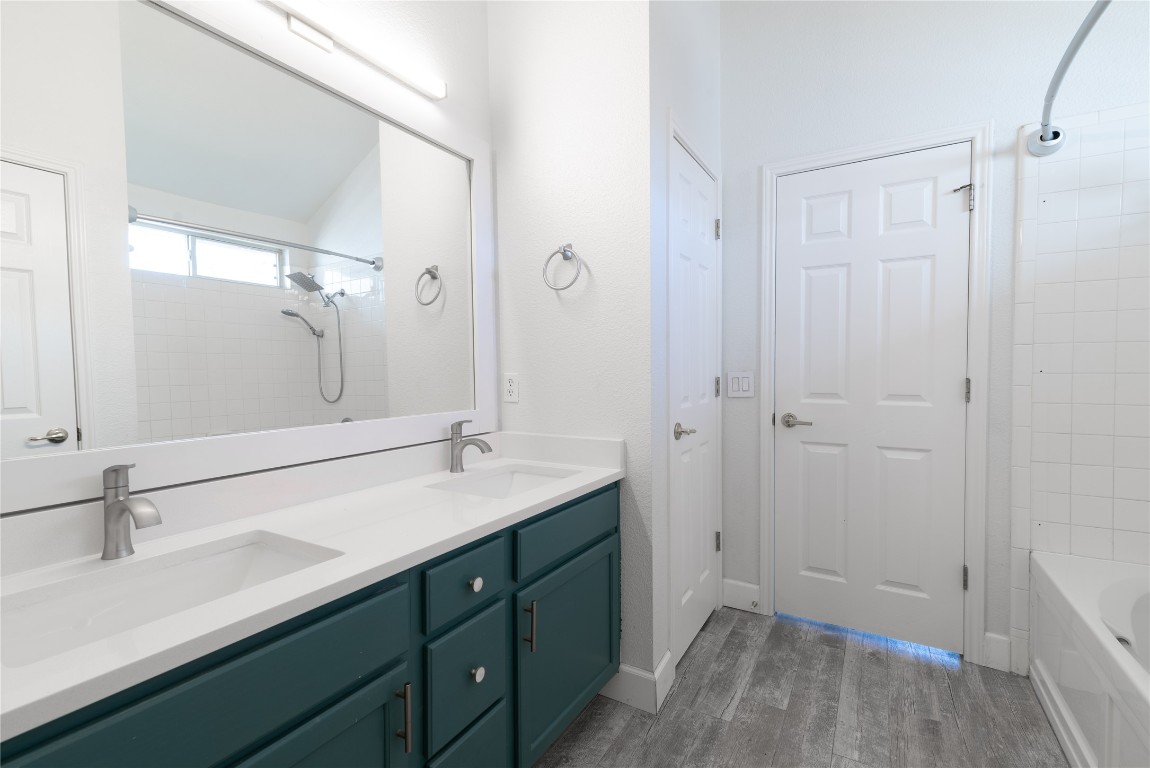 216 Brickyard Lane Jarrell, TX 76537 - Photo 18 of 33 a bathroom with a sink and a mirror