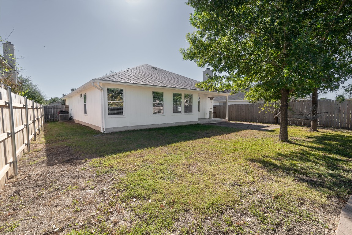216 Brickyard Lane Jarrell, TX 76537 - Photo 31 of 33 a front view of a house with a yard and trees