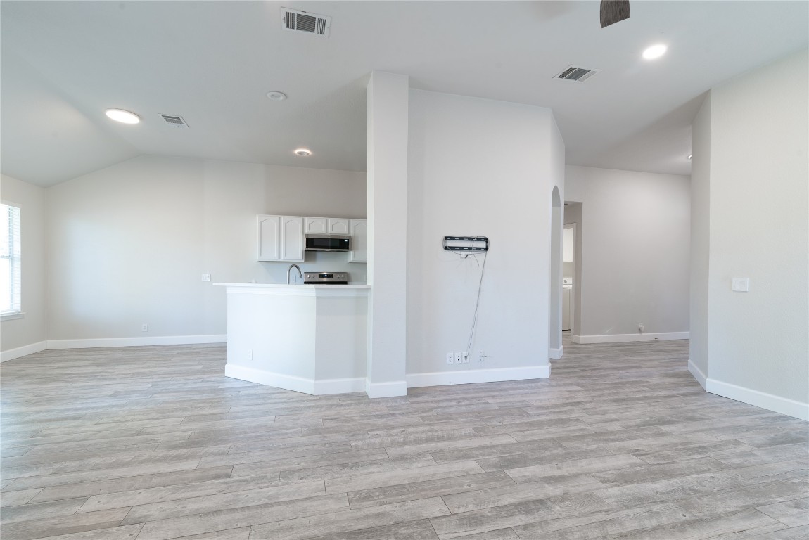 216 Brickyard Lane Jarrell, TX 76537 - Photo 10 of 33 a view of a kitchen with a sink and dishwasher wooden floor