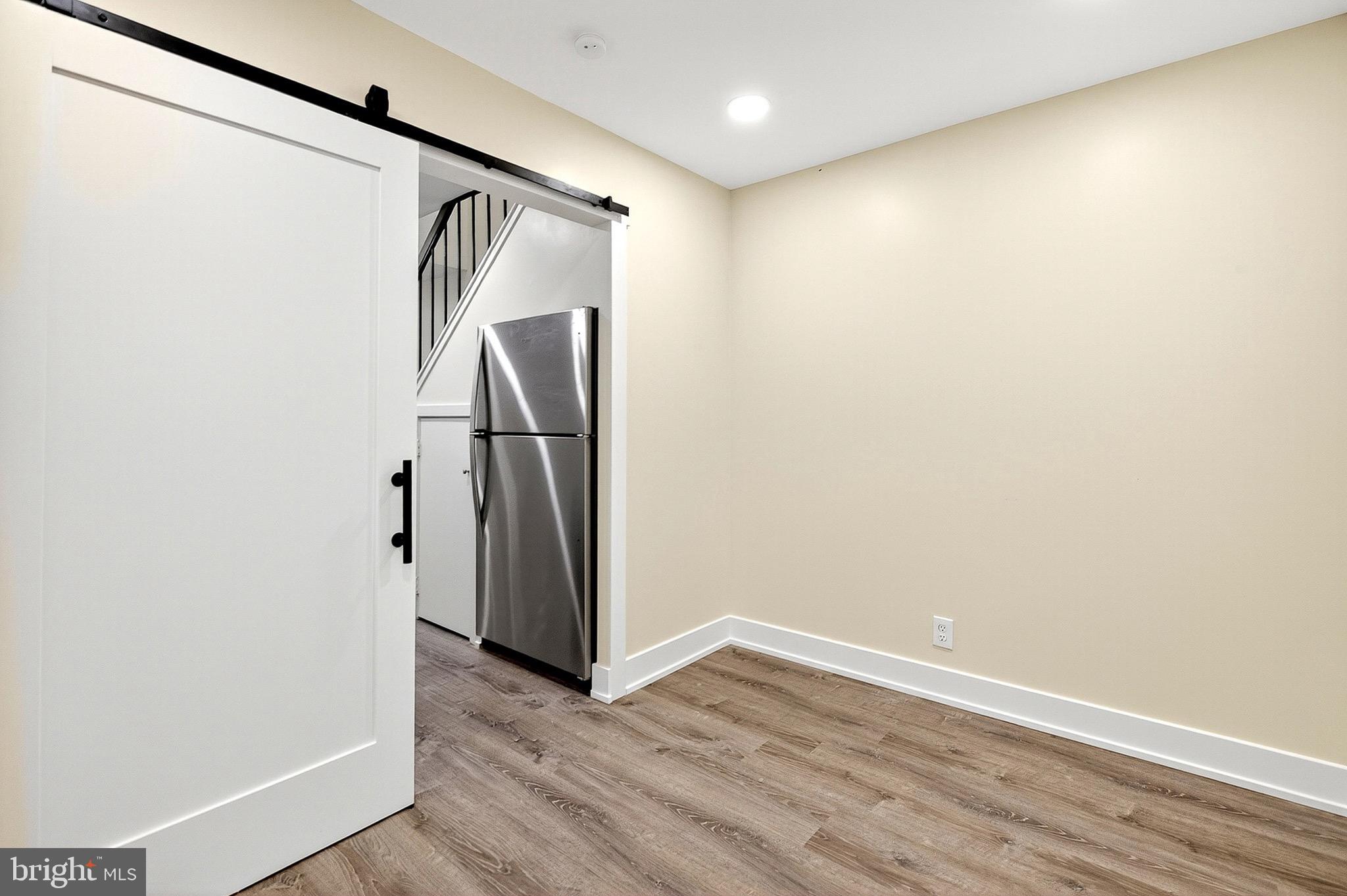567 Summit House West Chester, PA 19382 - Photo 17 of 31 a view of walk in closet with wooden floor
