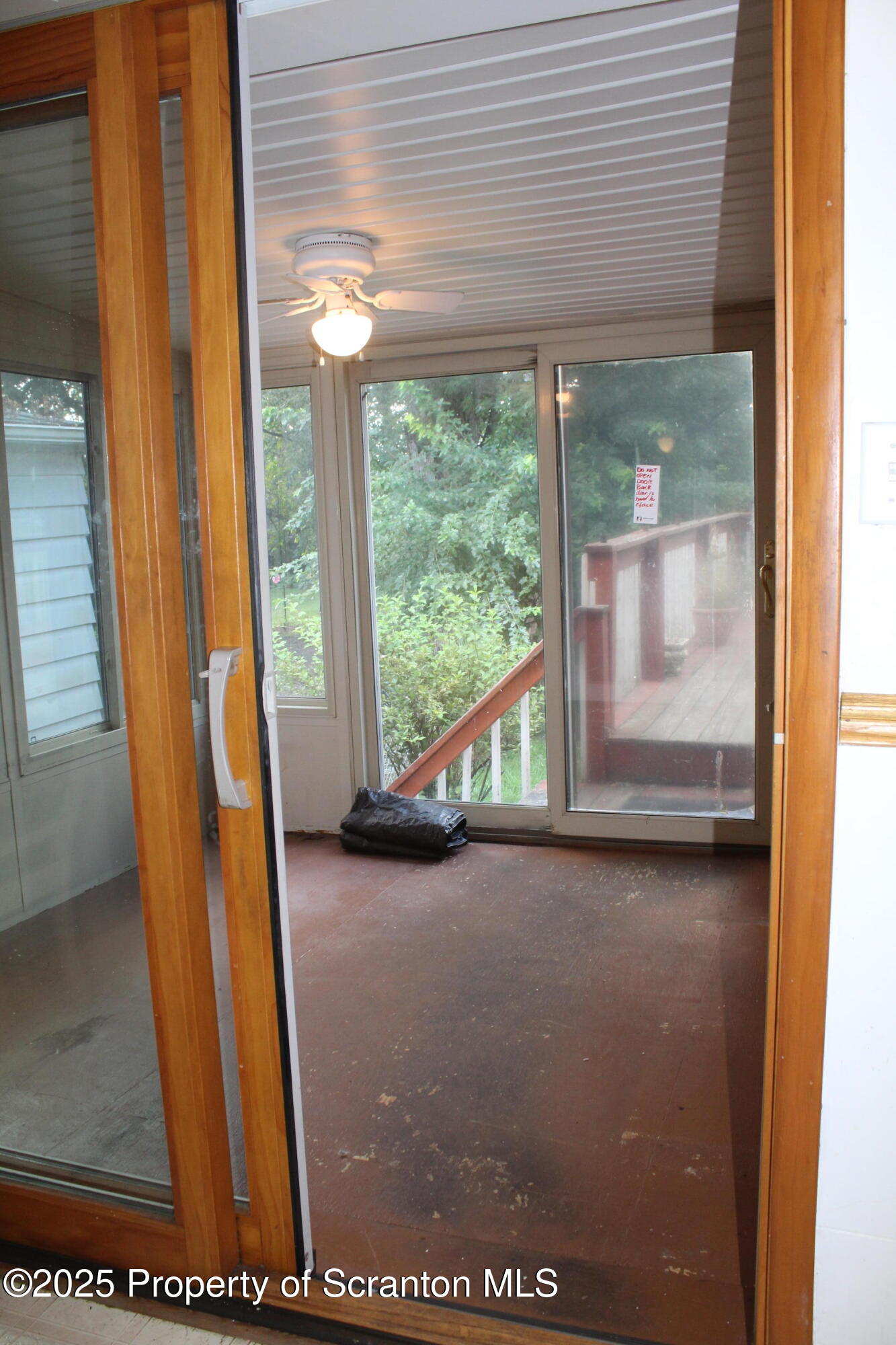 1919 Price Street Scranton, PA 18504 - Photo 11 of 44 a view of a room with wooden floor and windows