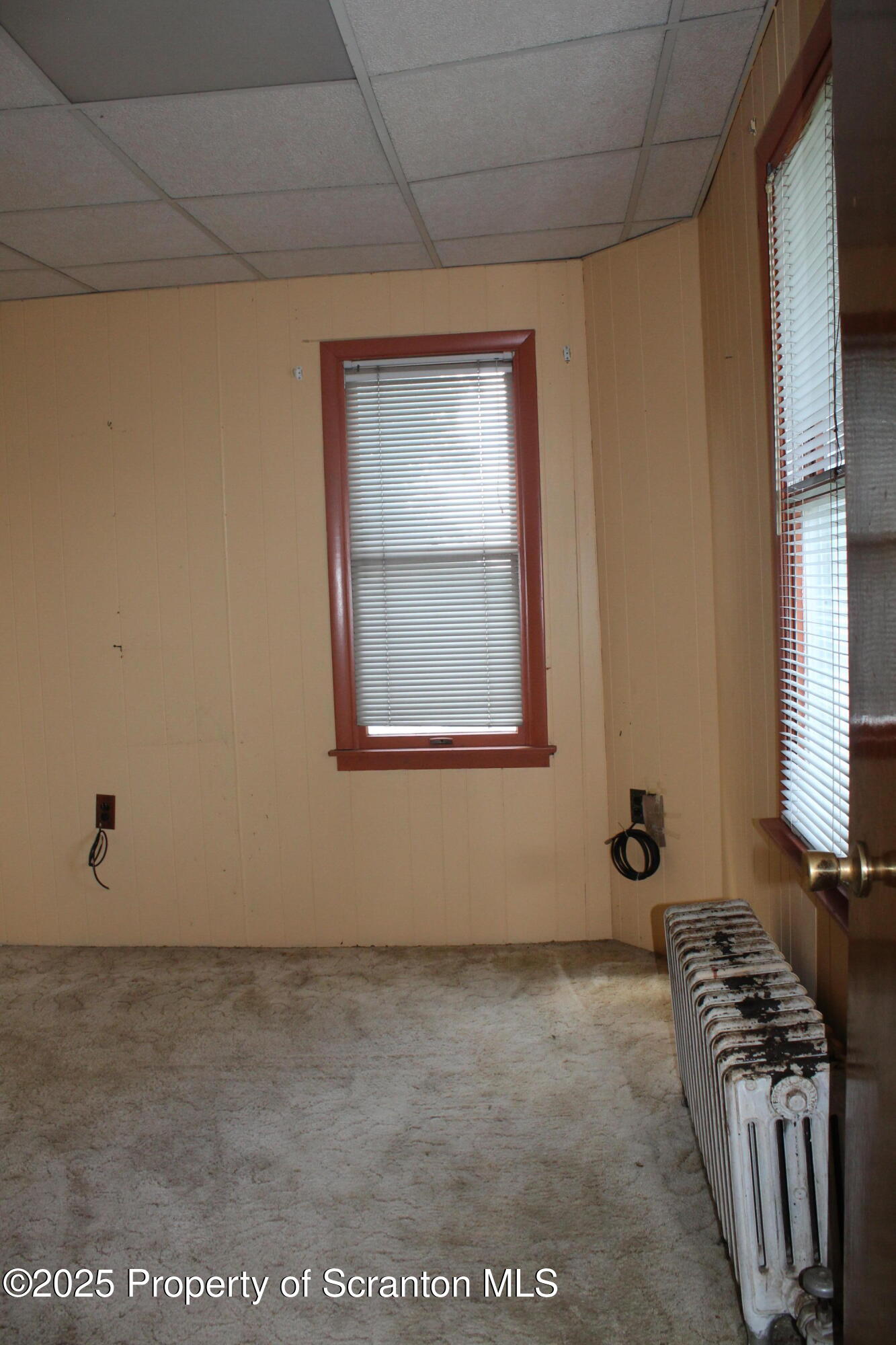 1919 Price Street Scranton, PA 18504 - Photo 13 of 44 a view of an empty room with a window