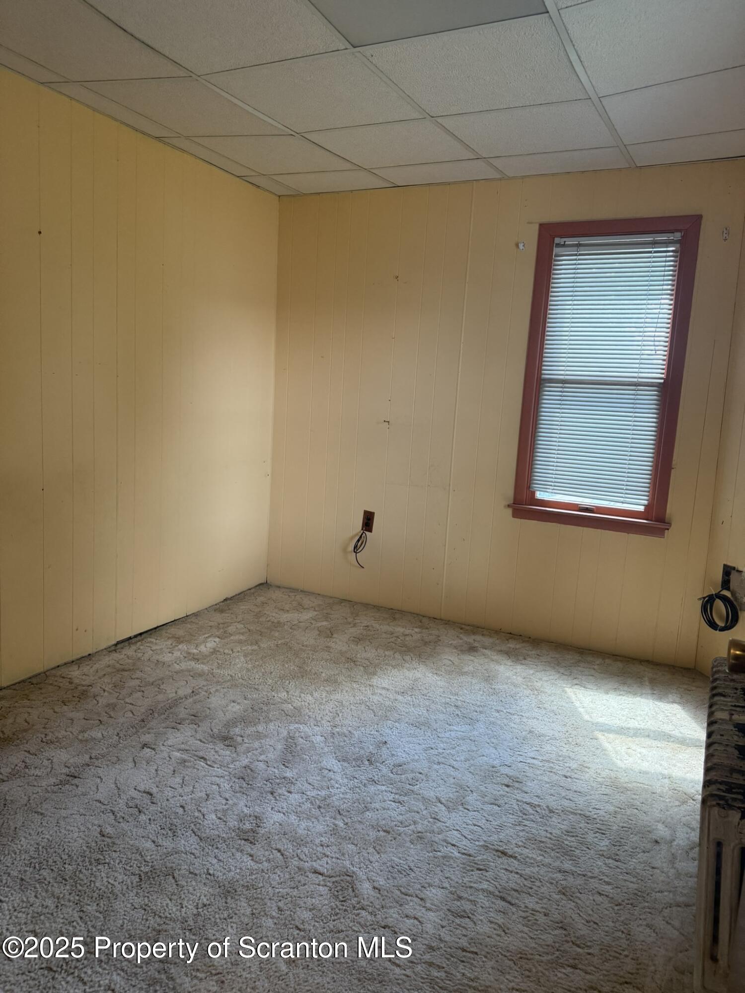 1919 Price Street Scranton, PA 18504 - Photo 17 of 44 a view of an empty room with a window