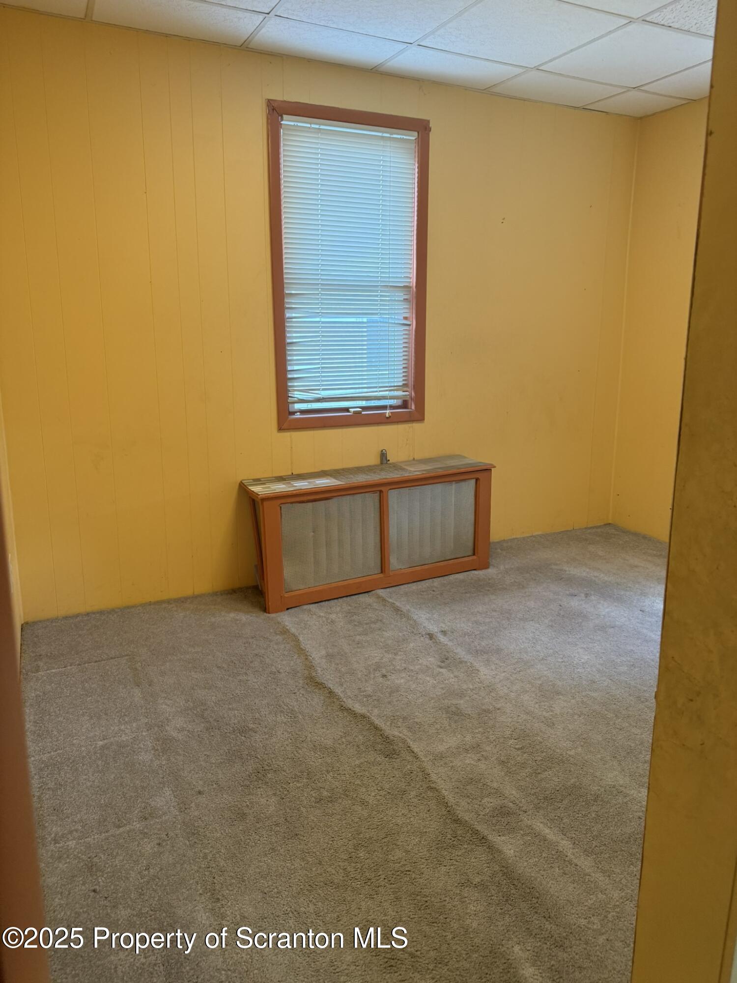 1919 Price Street Scranton, PA 18504 - Photo 18 of 44 a view of an empty room with a window